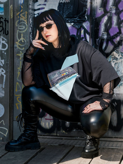 Black T-shirt with a graphic design of a keyboard with geometric colorful elements.