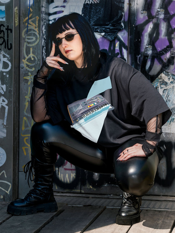 Black T-shirt with a graphic design of a keyboard with geometric colorful elements.