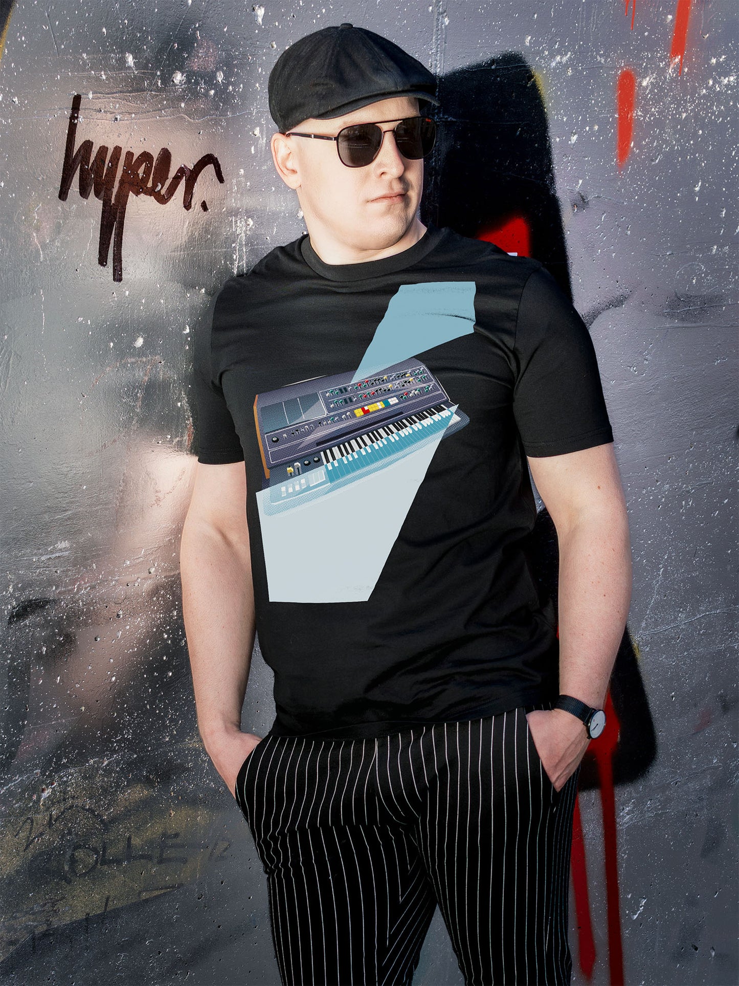 Black T-shirt with a graphic design of a keyboard with geometric colorful elements.