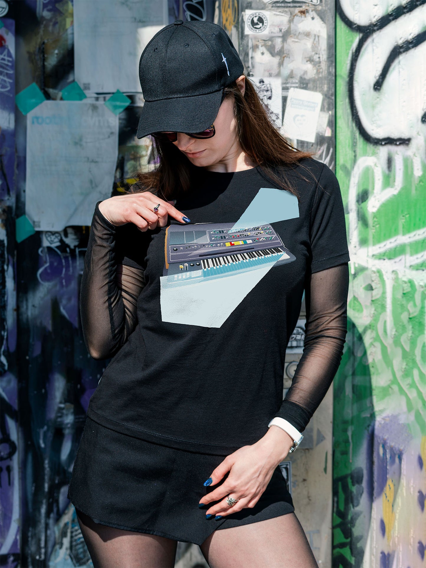 Black T-shirt with a graphic design of a keyboard with geometric colorful elements.