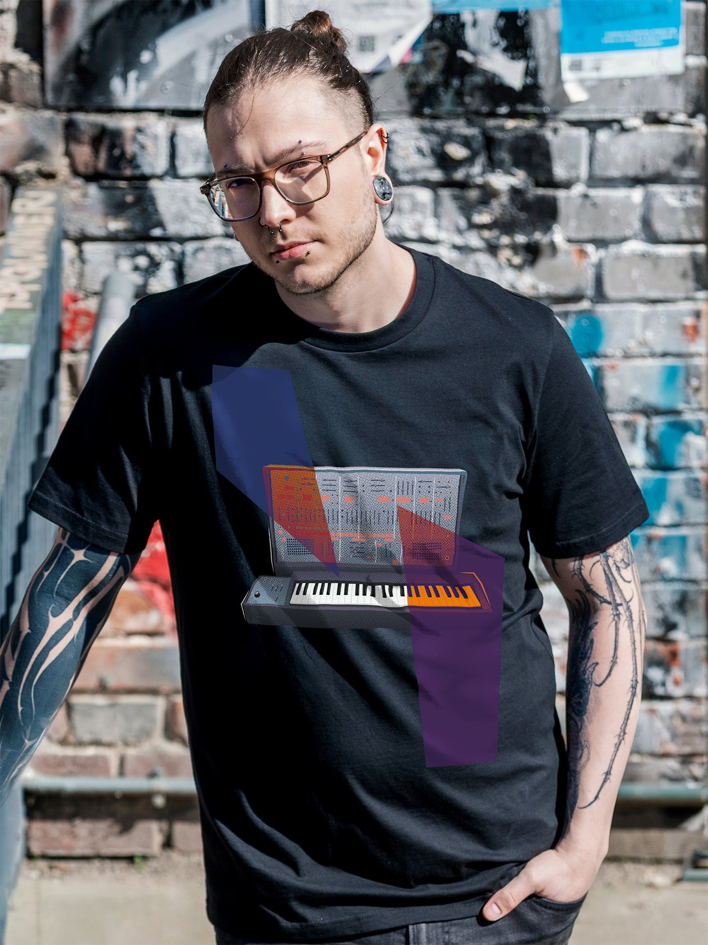 Black T-shirt with a graphic design of a keyboard with geometric colorful elements.