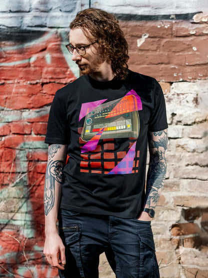 Black T-shirt with a graphic design of a drum machine 808 with purple and orange geometric colorful elements.