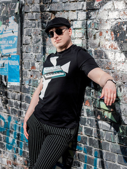 Black T-shirt with a design of a synthesizer and white geometrical light beams go out of the synth.
