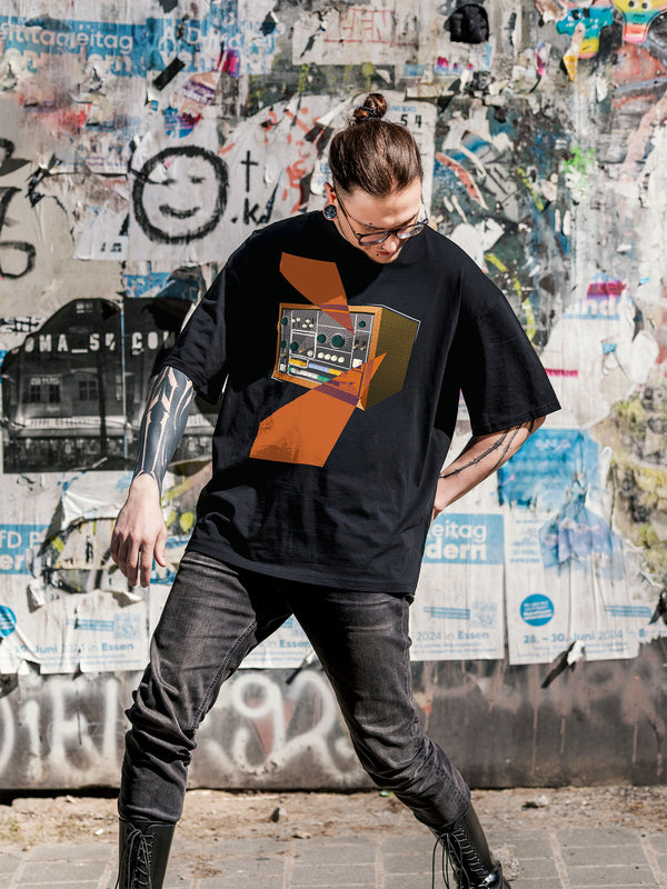 Black T-shirt with a retro graphic design of a colorful drum machine 78 with orange geometric colorful elements.