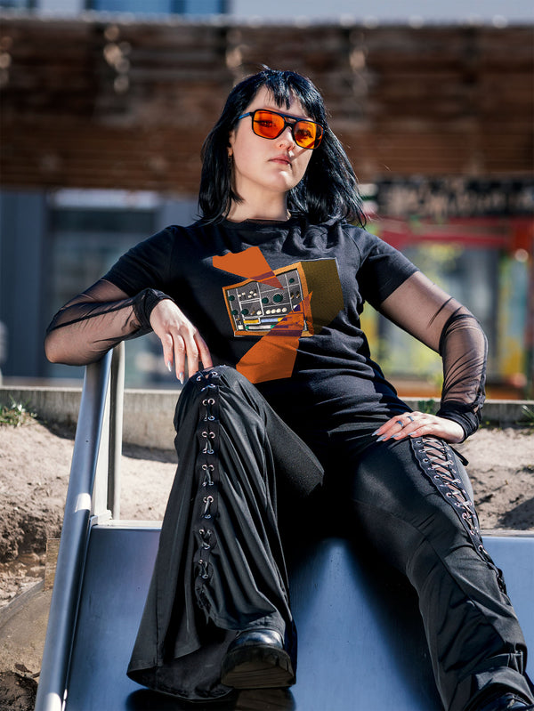 Black T-shirt with a retro graphic design of a colorful drum machine 78 with orange geometric colorful elements.